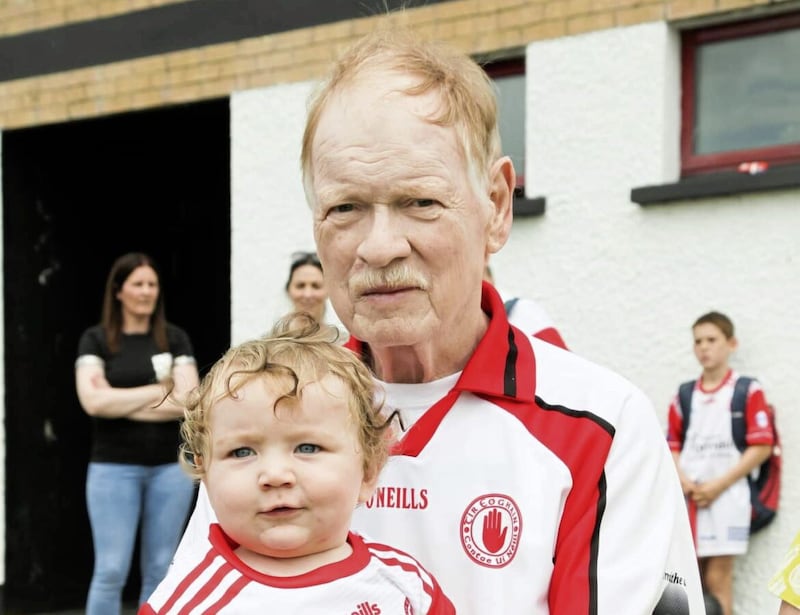 Brendan McAnallen pictured last week at a Campa Chormaic in Eglish holding his grandson Cormac, named after his son who died in 2004. Picture by Catherine Jones 