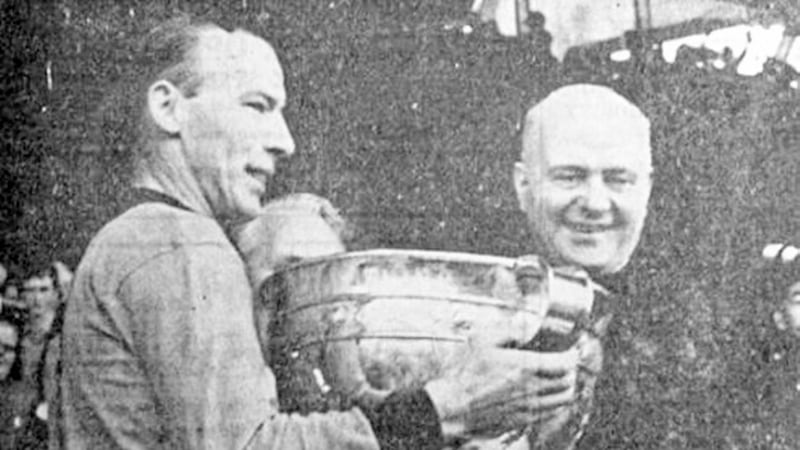 Cardinal Conway, primate of all Ireland, presents the Sam Maguire Cup to Down captain Joe Lennon in 1968