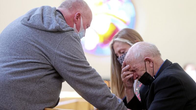 &nbsp;Bobby Clarke was shot during the Ballymurphy Massacre. He became emotional as the verdicts were returned in the inquest into the deaths of 10 innocent people and was comforted by Fr Paddy McCafferty in Corpus Christi Church. Picture by Mal McCann