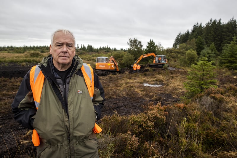 Jon Hill, of the Independent Commission for the Location of Victims’ Remains, stands besides excavators at Bragan bog near Emyvale in Co Monaghan (Liam McBurney/PA)