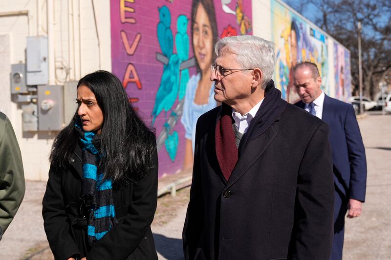 Attorney general Merrick Garland, right, and associate attorney general Vanita Gupta, left, tour murals of shooting victims in Uvalde, Texas (Eric Gay/AP)