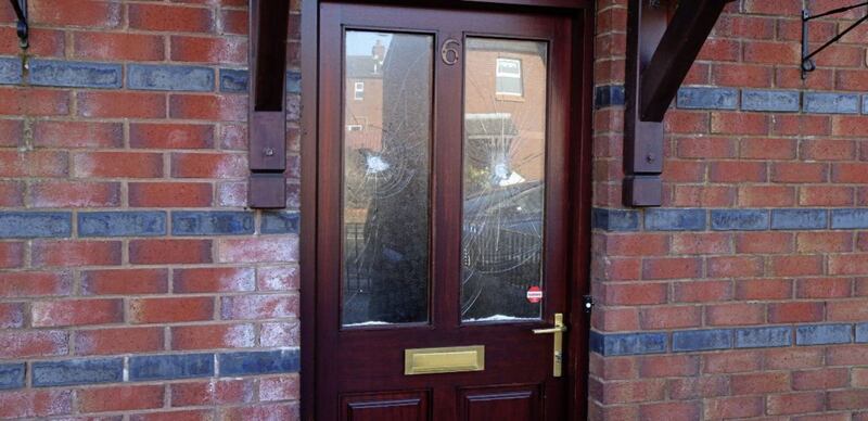 Windows smashed at a home in Alliance Close where a single mother and her four children have had to leave after receiving a &quot;warning&quot; in the post. Picture by Mal McCann. 