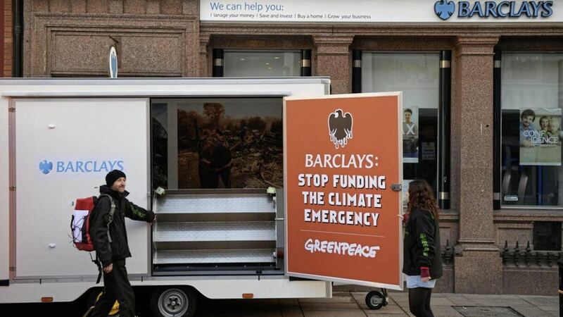 Greenpeace protestors set up an an exhibition at Castle Place in Belfast yesterday 
