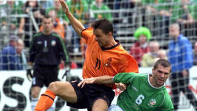 Republic of Ireland's Roy Keane (right) brings down Holland's Marc Overmars during the World Cup European Qualifying Group Two game at Lansdowne Road, Dublin on Saturday September 1 2001