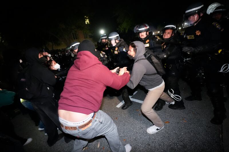 Police advance on demonstrators (AP)