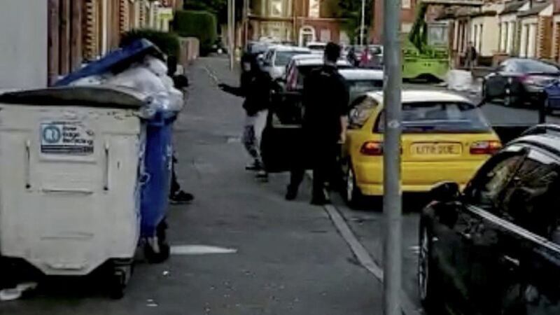 Members of the public confront two would be car thieves in south Belfast. 