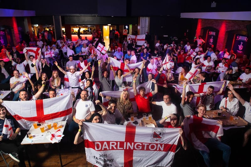 Fans wave St George's flags (David Parry/PA)
