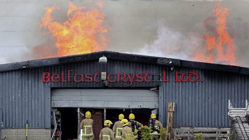 It took more than 40 firefighters to extinguish blaze at Belfast Crystal Ltd in the Kennedy Way Industrial Estate in west Belfast on Saturday evening. Picture by Niall Carson, PA Wire 