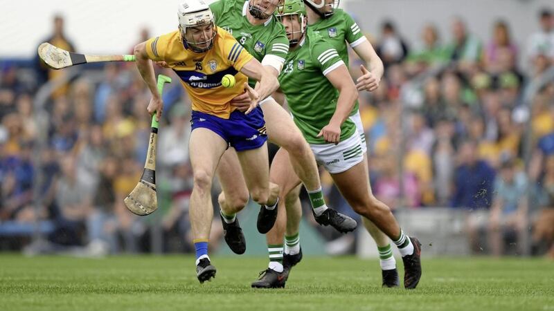 Ryan Taylor of Clare is tackled by William O'Donogue of Limerick during the Munster GAA Hurling Senior Championship Round 4 match at Cusack Park in Ennis. <br />Photo by Ray McManus/Sportsfile