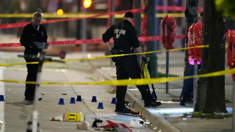 Denver Police Department investigators at the scene of a mass shooting (David Zalubowski/AP/PA)