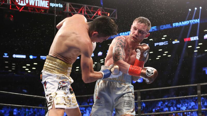 Carl Frampton lands a blow on Leo Santa Cruz during Saturday night's WBA Super World Featherweight Championship fight at the Barclays Center in New York&nbsp;<br />Picture by AP