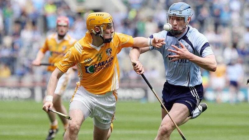 CJ McGourty tangles with Dublin's Joe Boland in his last appearance for the Antrim hurlers back in June 2009