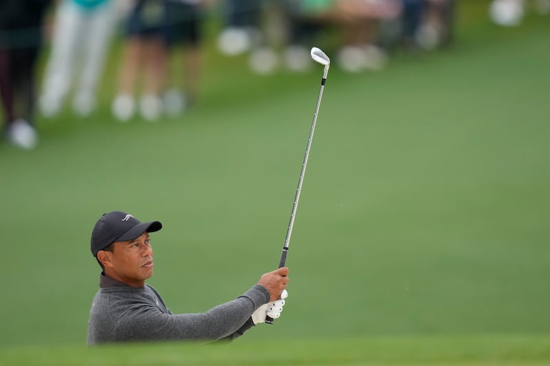 Tiger Woods hits to the second green during a practice round in preparation for the 88th Masters (Ashley Landis/AP)