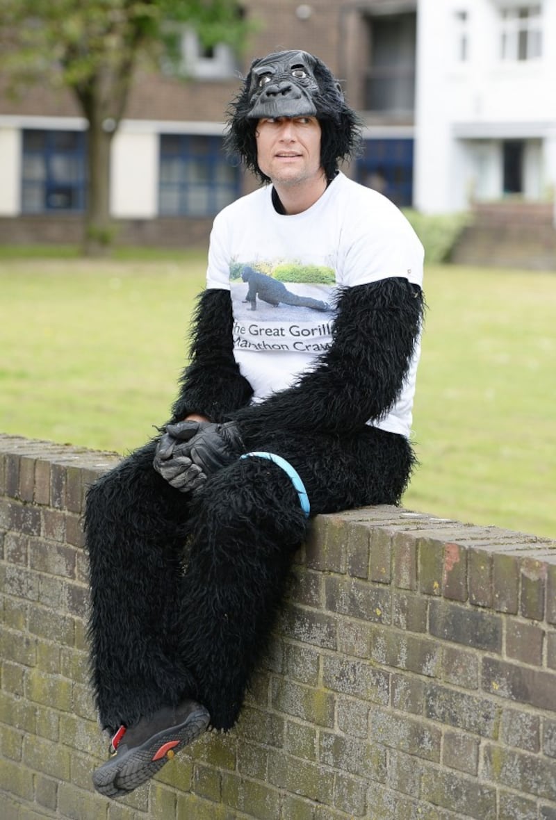 Metropolitan Police officer Tom Harrison, who goes by the name Mr Gorilla, in Bermondsey south east London, as he has been crawling the London Marathon in a gorilla costume since the race began on Sunday morning.