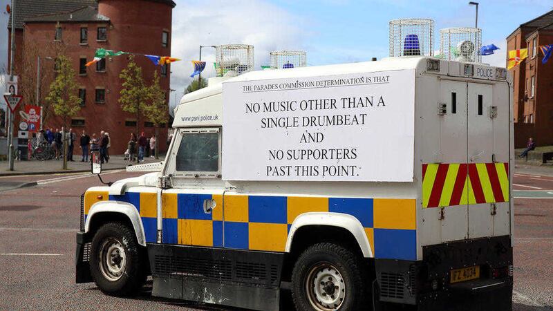 A police Land Rover displays the Parades Commission determination beside St Patrick&#39;s Church. Picture by Cliff Donaldson. 