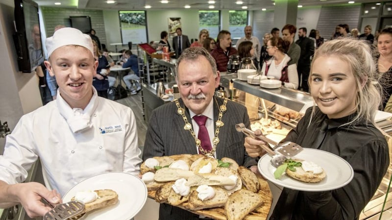 Mayor of Derry and Strabane District Council Maol&iacute;osa McHugh serves the first breakfast at North West Regional College&#39;s newly refurbished Flying Clipper Brasserie, with hospitality and catering students Calum Falls and Siobhan Walton. Picture by Martin McKeown 