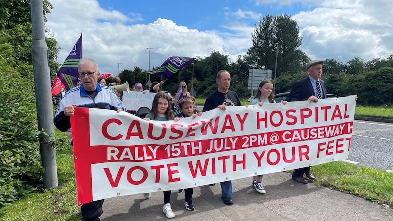 Campaigners take part in a rally at Causeway Hospital in Coleraine (Jonathan McCambridge/PA)