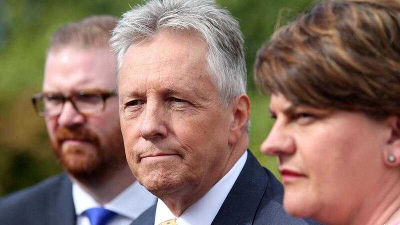 DUP leader Peter Robinson, who has temporarily stepped aside leaving party colleague Arlene Foster at the helm, and Simon Hamilton who is one of the DUP ministers adopting an in/out policy at Stormont 