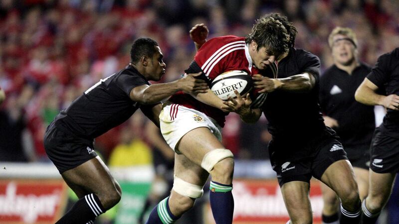 British &amp; Irish Lions' Donncha O'Callaghan breaks through the tackle from New Zealand's Sitiveni Sivivatu (left) and Tana Umaga) during third Test match at Eden Park, Auckland, New Zealand, Saturday July 9 2005