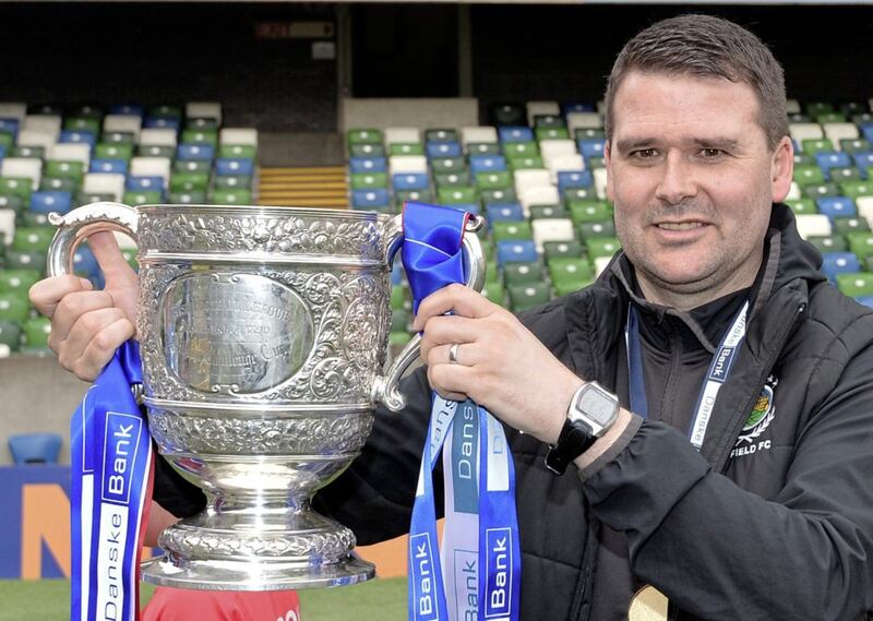 Linfield manger David Healy raises the Gibson Cup in 2019