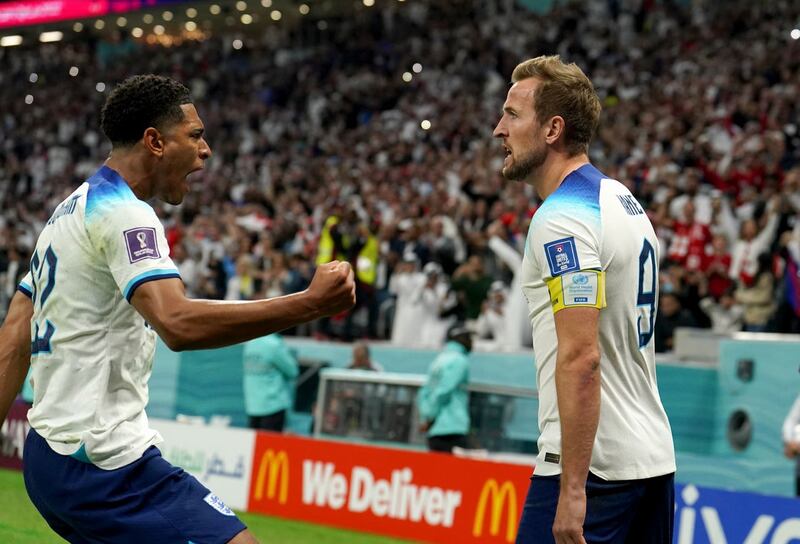 England’s Harry Kane (right) celebrates with Jude Bellingham after scoring their side’s first goal of the game from the penalty spot during the World Cup quarter-final against France.