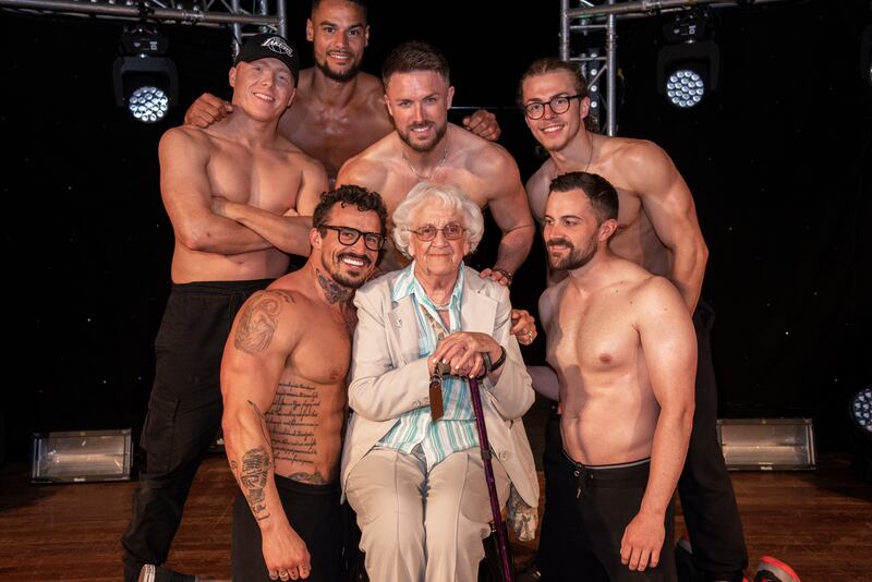 Betty Richardson (middle) pictured with male striptease performers Dreamboys at the Bournemouth Pavilion Theatre