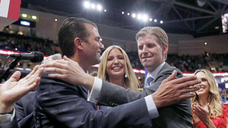 Donald Trump Jr, left with his siblings Ivanka Trump, and Eric Trump  