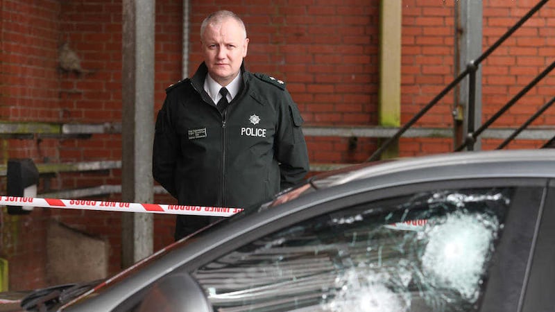Belfast Commander Chief Superintendent Nigel Grimshaw at the police car that was ambushed in west Belfast. Picture by Mal McCann