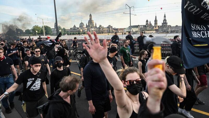 Participants of a left-wing demonstration gather in Dresden (Robert Michael/dpa/AP)