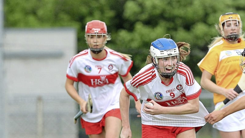 Derry's &Aacute;ine McAllister attempts to go past Sinead Martin of Antrim during the Ulster Senior Camogie Final played at Swatragh on Sunday June 4 2017. Picture by Margaret McLaughlin