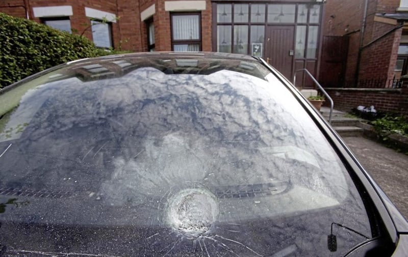 Damage caused to a car parked in Gerry Adams&#39; driveway following an attack on his home. 