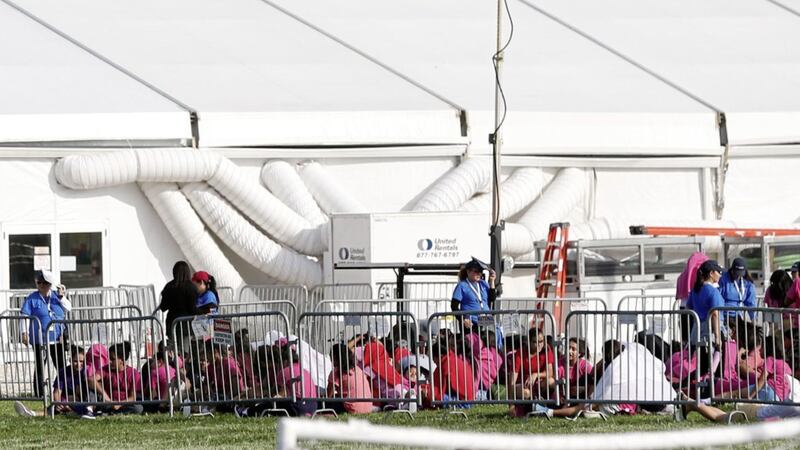 Immigrant children are shown outside a former Job Corps site that now houses them in Florida Picture by Wilfredo Lee/AP 