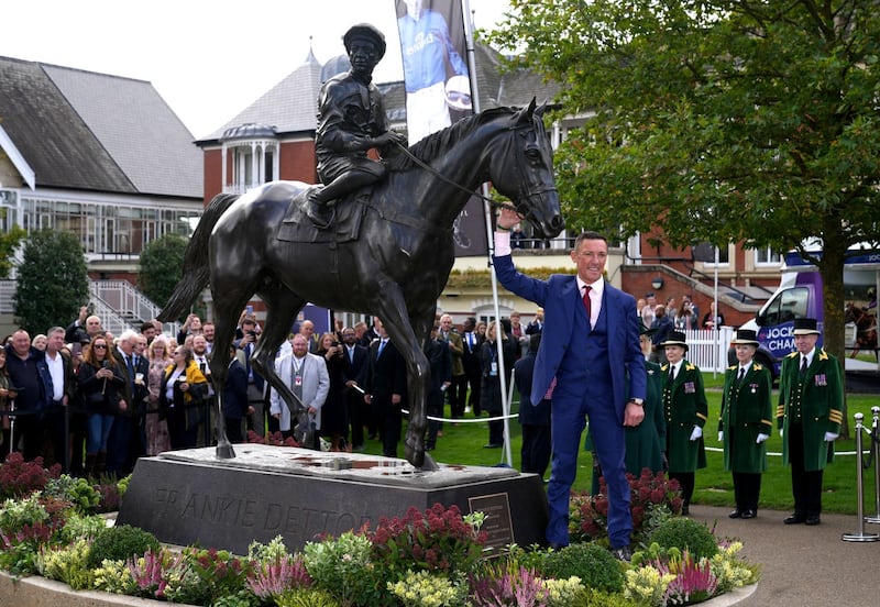 Dettori posed for pictures with the sculpture (John Walton/PA)