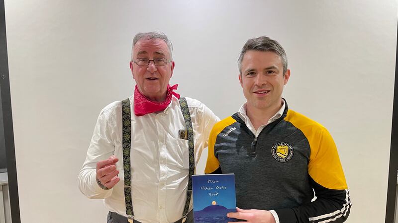 Ulster Scots enthusiast and author Liam Logan (left) and East Belfast GAA club secretary David McGreevy at the club’s Ulster Scots evening at the Stormont Pavilion on Wednesday (PA)