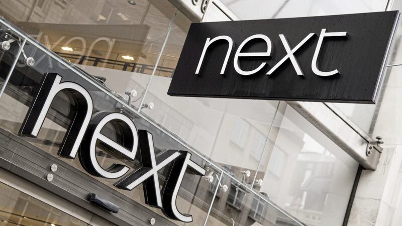 Fashion chain Next has raised its annual profit outlook after seeing full-price sales lift 5 per cent in the past three months as the spell of hot weather boosted summer clothing purchases 