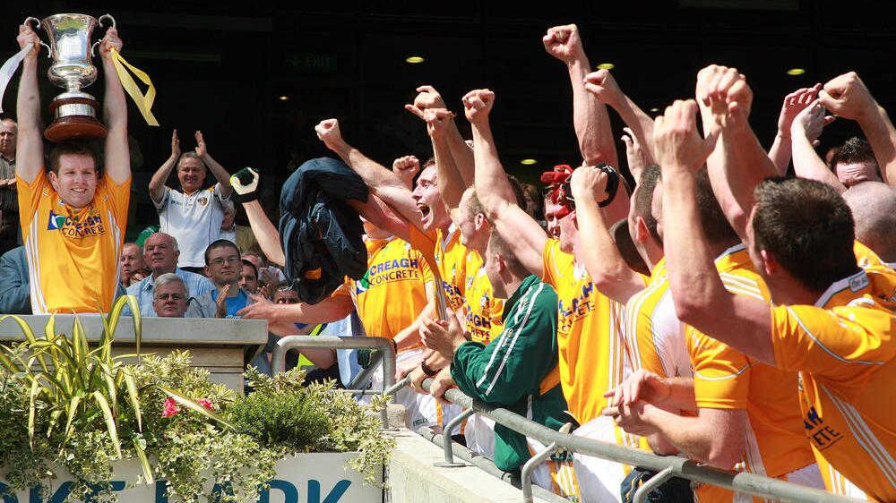Antrim captain Kevin Brady lifts the Tommy Murphy Cup in Croke Park while his team-mates celebrate back in 2008. The competition was disbanded after that decider but the GAA appear keen to restore it from next year onwards. Our readers are not so enamoured with the idea. Picture by Seamus Loughran 
