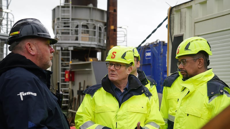 Labour leader Sir Keir Starmer, centre, and new Welsh First Minister Vaughan Gething, right, during a visit to the Port of Holyhead in North Wales