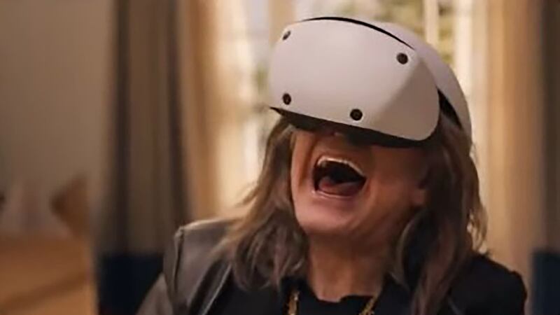 Ozzy Osbourne tries out a VR headset as part of the tweet which has been banned (Screengrab from video/PA)