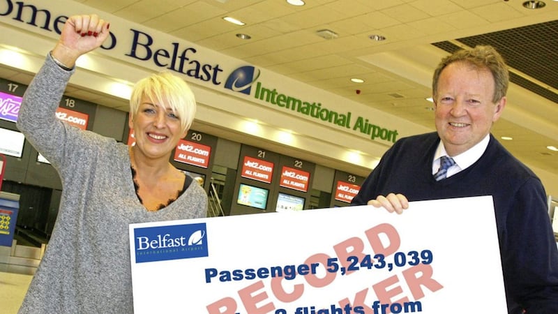 Record breaker - Passenger 5,243,039 Glenda Garrett from Larne wins free flight tickets to mark Belfast International Airport&#39;s new record. Included is Graham Keddie, Belfast International Airport managing director 