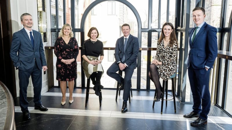 Carson McDowell managing partner Roger McMillan and senior partner Neasa Quigley (both seated centre) with (from left) new partners Richard Dickson, Hilary Griffith, Kathleen Byrne and Damian McElholm. Picture: Elaine Hill 