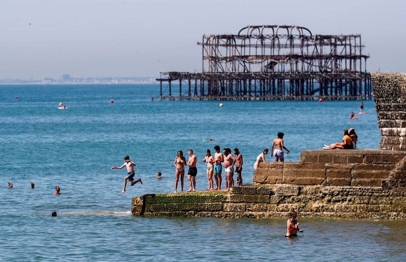 Sun-seekers at Brighton beach on August 7 