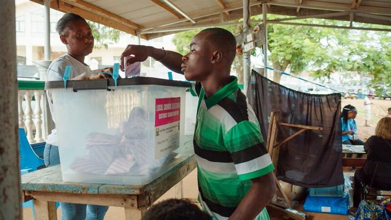 A man cast his ballot in Freetown (AP)