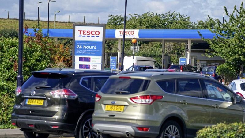 Cars queue at Tesco near Stanwell, Middlesex. Picture by Steve Parsons/PA Wire 