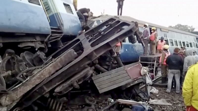 An image from video shows rescuers and onlookers at the derailed passenger train in Kuneru, Andhra Pradesh, southern India. Picture by KK Production via Associated Press 