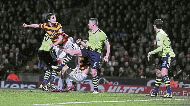 Bradford City&#39;s Carl McHugh scores his side&#39;s third goal during the Capital One Cup semi-final, first leg match against Aston Villa at the Coral Windows Stadium, Bradford on Tuesday January 8 2013. 