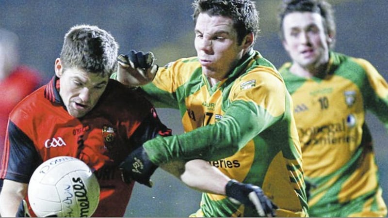 Ronan Sexton of Down is challenged by Donegal&rsquo;s Kevin Cassidy during the 2010 Dr McKenna Cup semi-final in Brewster Park, Enniskillen 