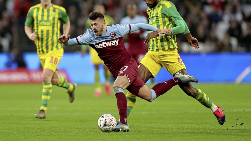 West Ham United&#39;s Albian Ajeti (left) is fouled by West Bromwich Albion&#39;s Semi Ajayi during the FA Cup fourth round match at the London Stadium. 