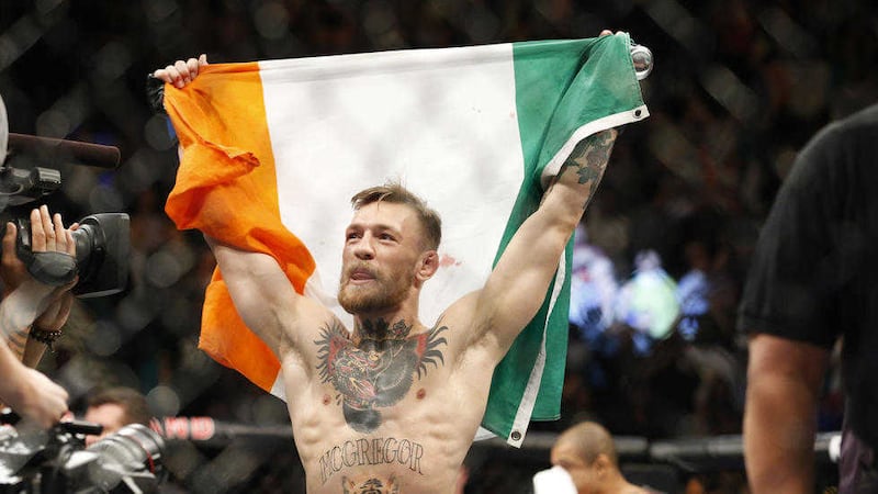 Conor McGregor reacts after defeating Jose Aldo during the featherweight championship mixed martial arts title bout at UFC 194. 