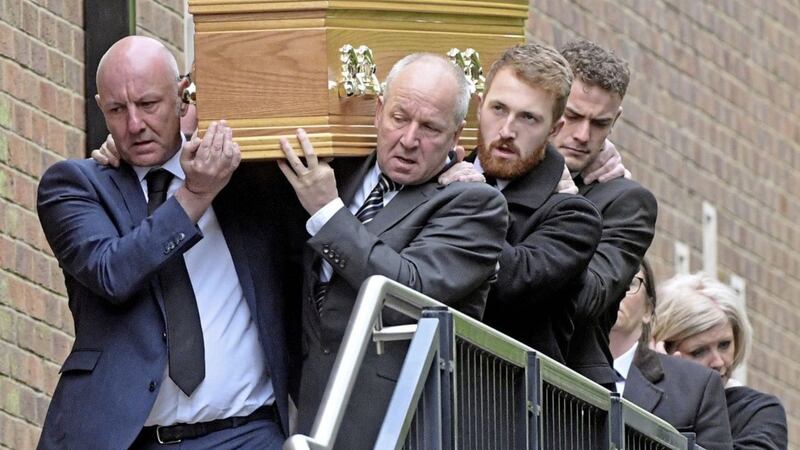 Mourners carry the coffin of stabbing victim Niall Magee during a funeral service at St Gerard&#39;s Church on Belfast&#39;s Antrim Road. Picture by Hugh Russell. 