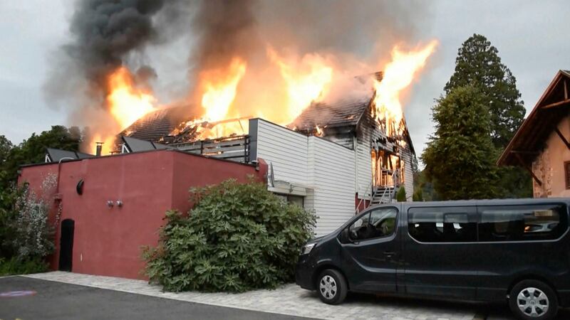Fire rages at a holiday home in the town of Wintzenheim (TNN/dpa via AP)